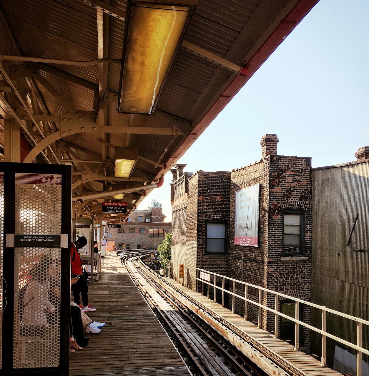 architecture, built structure, railroad track, the way forward, building exterior, transportation, rail transportation, railroad station platform, railroad station, diminishing perspective, public transportation, vanishing point, city, clear sky, incidental people, long, narrow, city life, day, outdoors