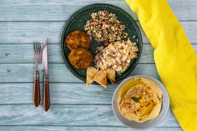 Typical dish of mediterranean cuisine in a wooden background