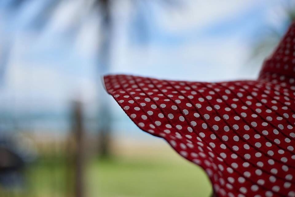 focus on foreground, close-up, selective focus, red, part of, pattern, textile, day, fabric, detail, outdoors, striped, design, no people, protection, multi colored, pink color, cropped, fashion