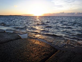 Scenic view of sea against sky during sunset