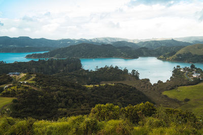 Scenic view of lake and mountains against sky