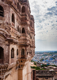 Ancient fort with blue city view and flat bright sky at morning