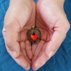 Close-up of human hand holding ladybug