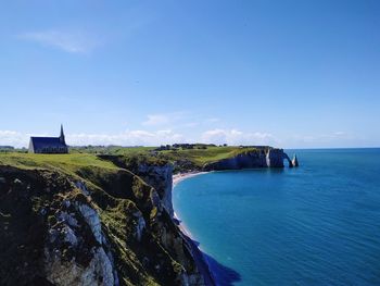 Scenic view of sea against blue sky