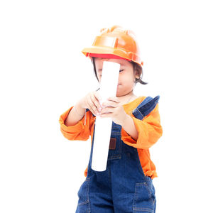 Boy holding umbrella against white background