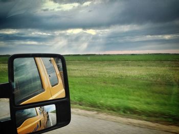 Car on road at sunset