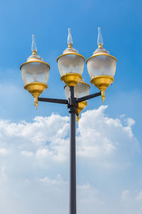 Low angle view of street light against sky