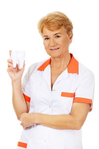 Portrait of a smiling young woman over white background