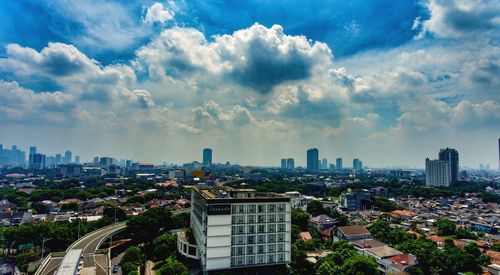 High angle view of buildings in city against sky