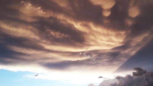 Low angle view of clouds in sky during sunset