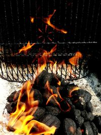 Close-up of bonfire with fire crackers at night