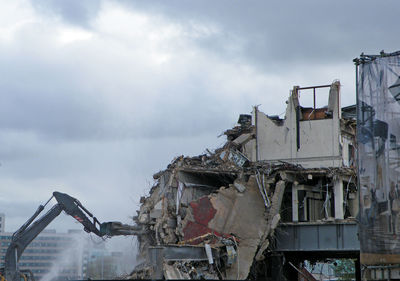 Demolition site with hydraulic hammer