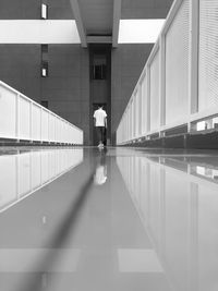 People walking in illuminated building