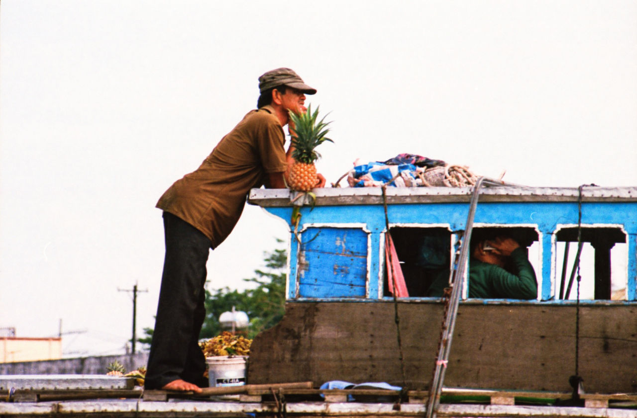 MAN WORKING AGAINST BUILT STRUCTURE