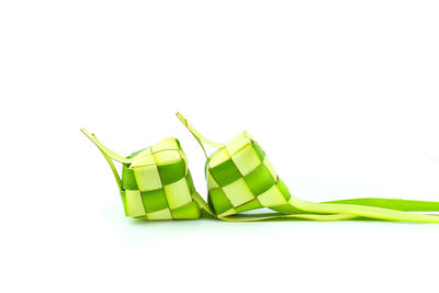 Close-up of green pepper against white background