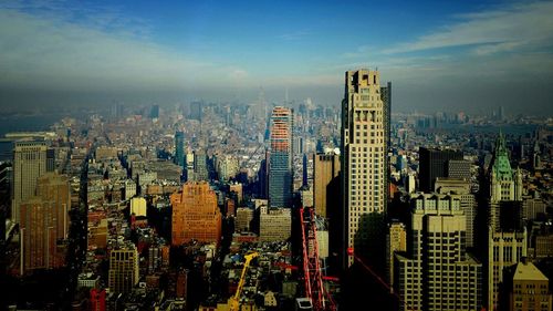 High angle view of buildings in city against sky