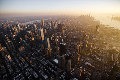 High angle view of modern buildings in city against sky