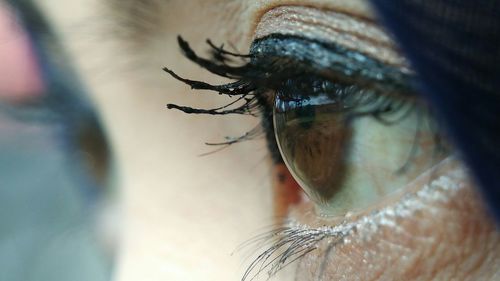 Extreme close-up of woman looking away