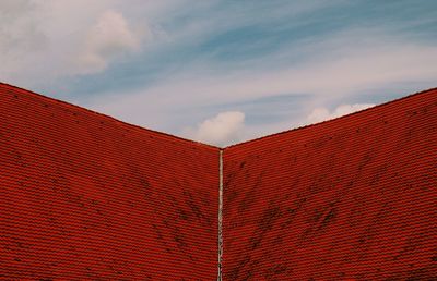 Low angle view of red roof against sky