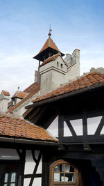 Low angle view of bell tower against sky