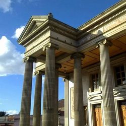 Low angle view of built structure against blue sky