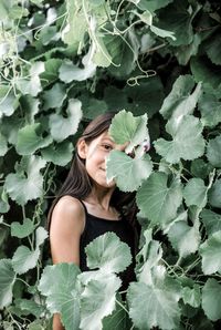 High angle view of woman with plants in foreground