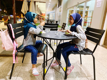 People eating food in restaurant