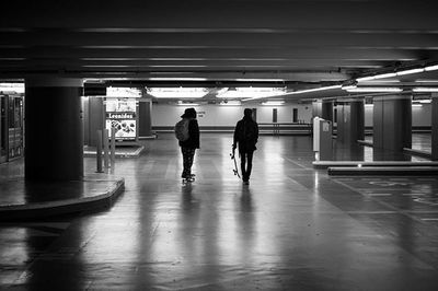 Silhouette of people in subway station