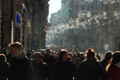 Crowd at illuminated city at night