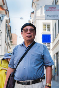 Portrait of a man standing outdoors