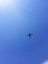 Low angle view of airplane flying in sky