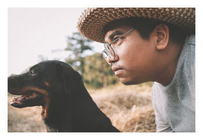 Side view of man with dog