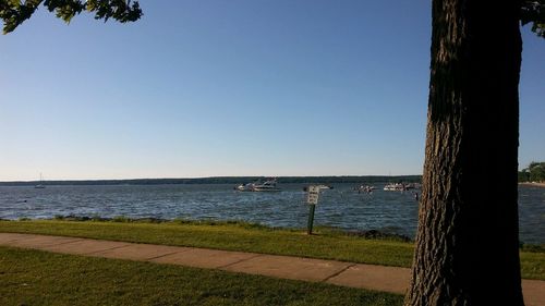 Scenic view of sea against clear blue sky