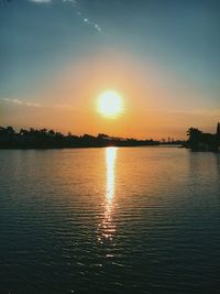 Scenic view of lake against sky during sunset