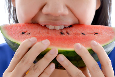 Close-up of woman eating fruit