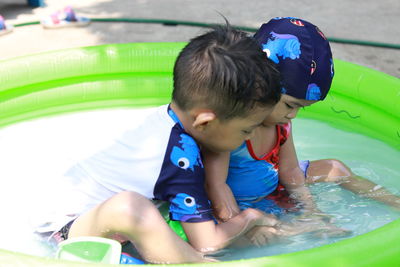 Boy playing in swimming pool