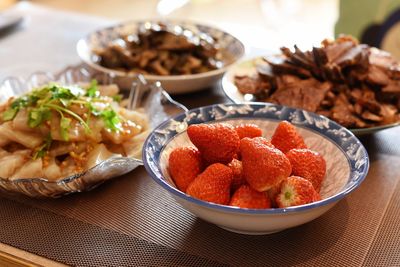 High angle view of fruits in plate on table