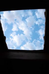 Low angle view of sky seen through window