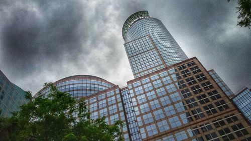 Low angle view of tower against cloudy sky