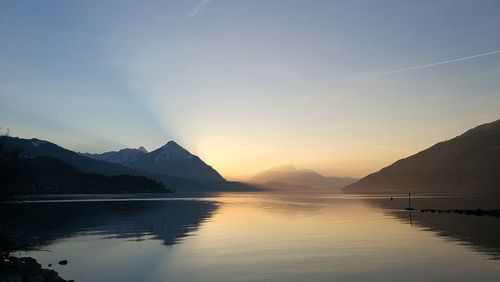 Scenic view of lake against sky during sunset