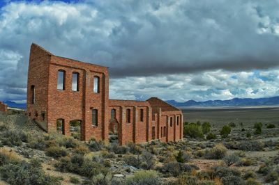 Built structure against cloudy sky