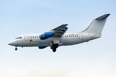 Airplane flying against clear sky