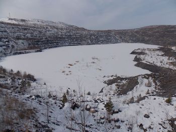 Scenic view of landscape against sky during winter