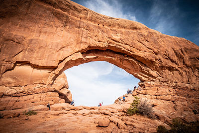 Low angle view of rock formation against sky