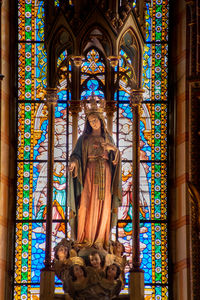 Statue in temple against building