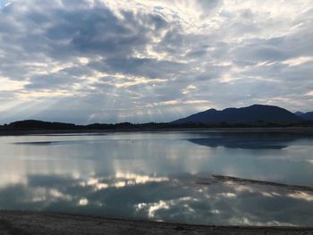 Scenic view of lake against sky during sunset