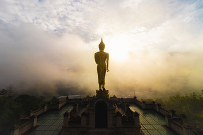 Low angle view of statue against sky during sunset