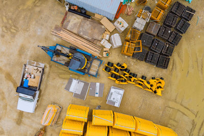 High angle view of yellow construction site by building