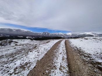 Scenic view of snow covered mountain against sky