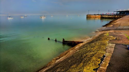 Scenic view of calm sea against sky